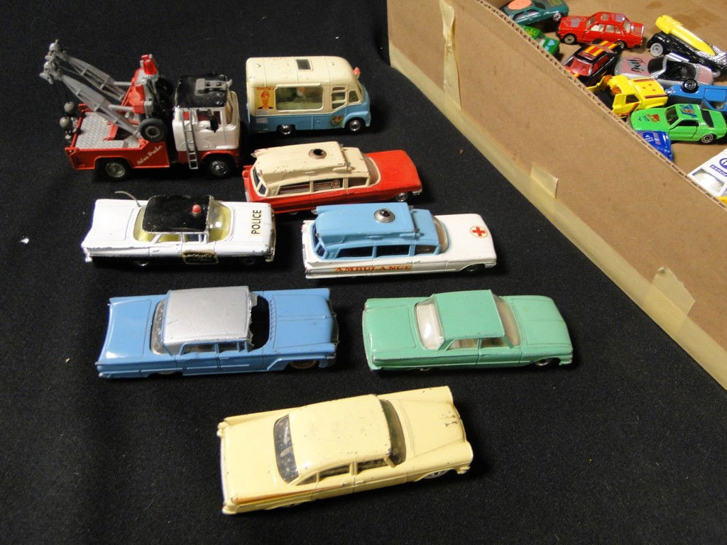 Group of toys to include Corgi Major Toys: tow tru: Group of toys to include Corgi Major Toys: tow truck, ice cream truck, Chevrolet Impala police car, (2) Superior Cadillac ambulance, Dinky Toys: Lincoln Premier car; Ford Fairlane; Dodge Royal Sedan,