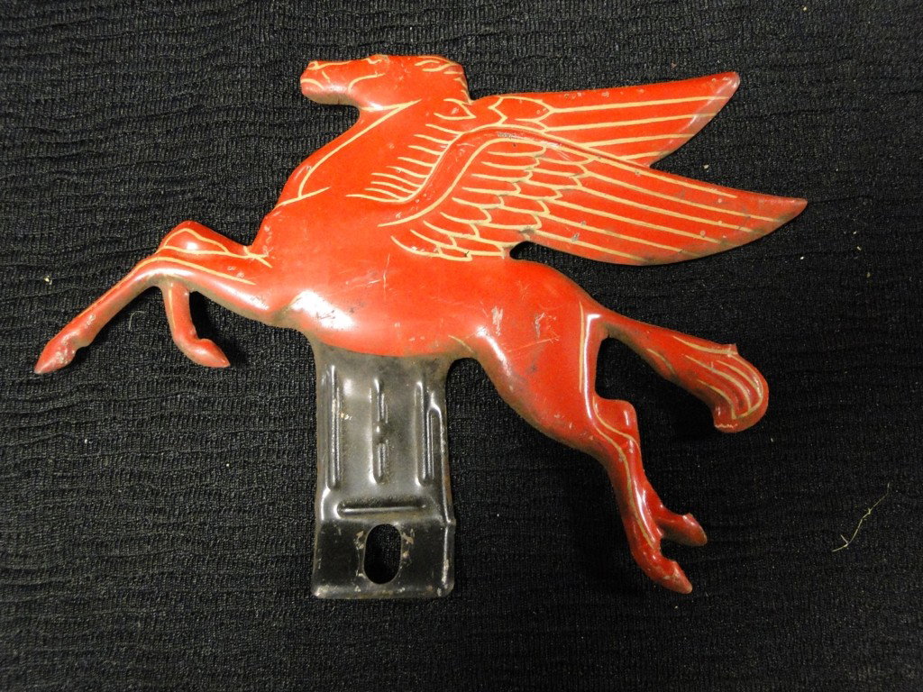 An early Mobile flying horse porcelain over tin em: An early Mobile flying horse porcelain over tin emblem