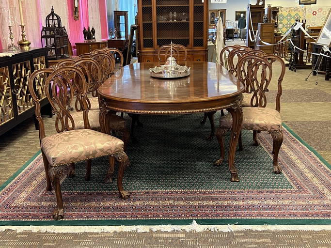 An Elaborately Carved Karges Dining Room Suite
