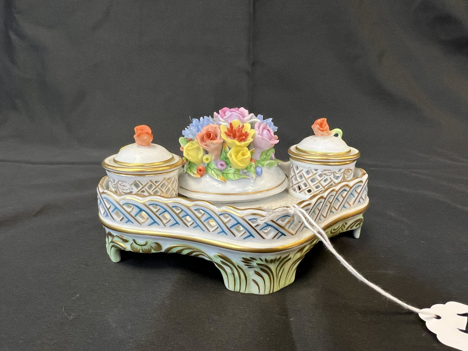 Signed Herend Porcelain Inkwell: A Signed Herend Hungary inkwell with elaborate latticework and floral decoration. It retains all of its original parts and covers. In excellent condition, it measures 6" across X 4.5" deep X 2.5" tall