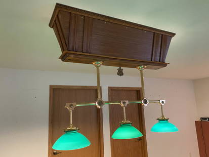 Brunswick-Balke-Collender Pool Table Light: A Brunswick-Balke-Collender Company pool table light with 3 green-case glass shades and brass fittings over a contemorary oak encasement top which that matches the pool table. This fixture includes th