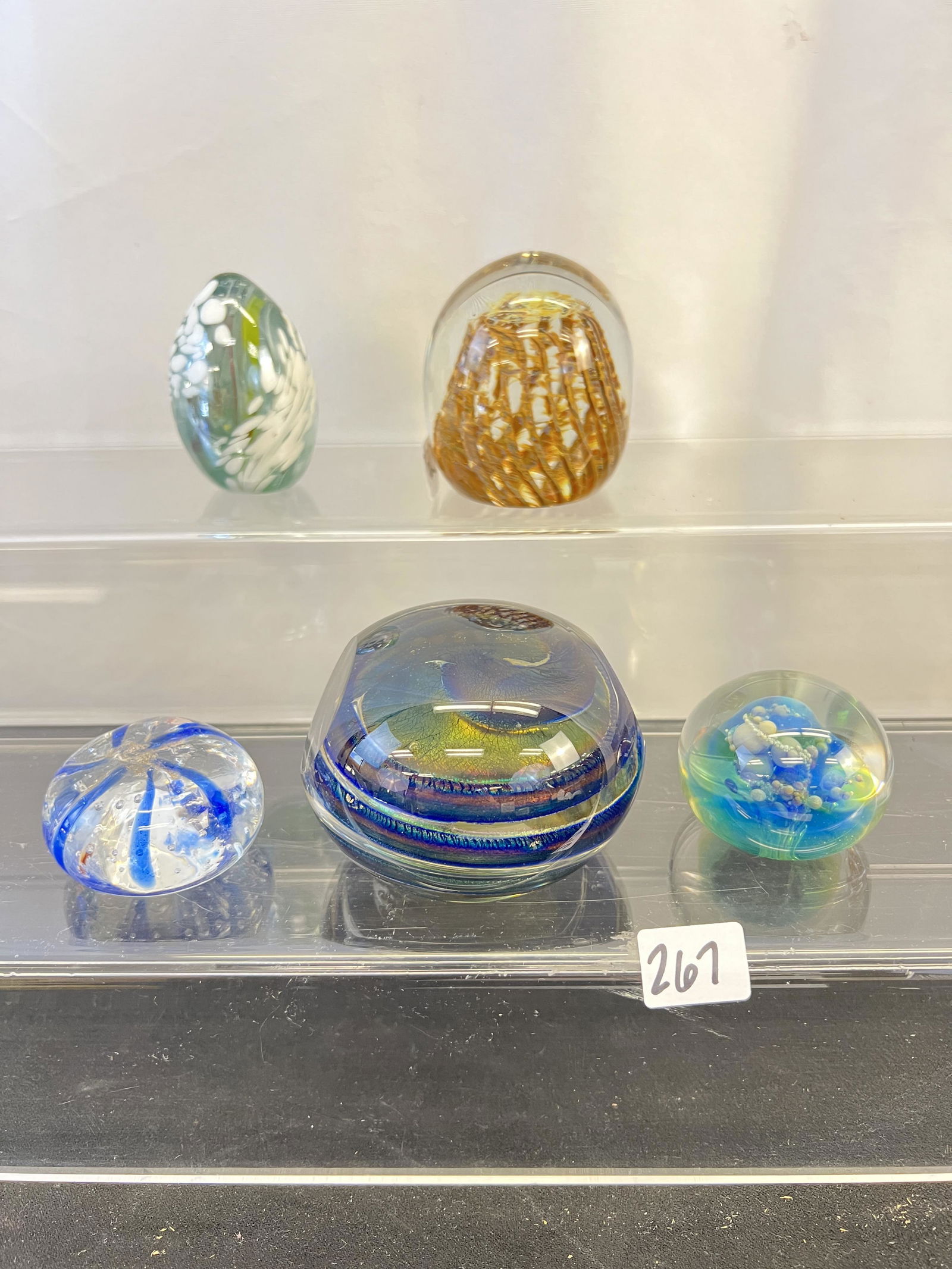 Art Glass Paperweights, Brett Cox , More!: This group of 20th Century art glass paperweights include a blue swirl paperweight signed Brent Cox and dated 1985 (2.5" tall X 3" across), a white speckled egg (3" tall ), a paperweight signed Peter
