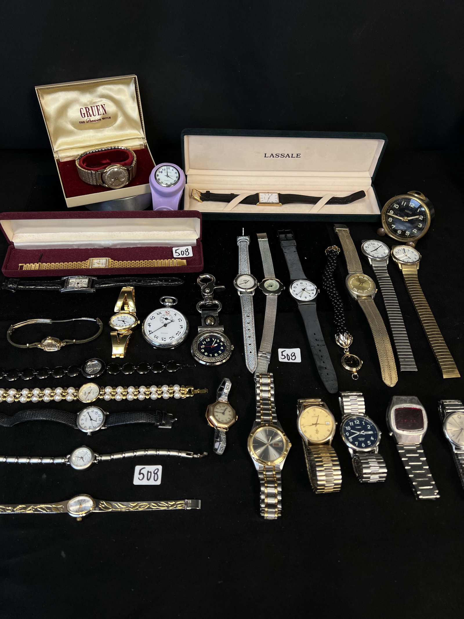Large Lot of Watches: A box of watches to include Lassale, Gruen, Timex, Roamer, Sutton & more.