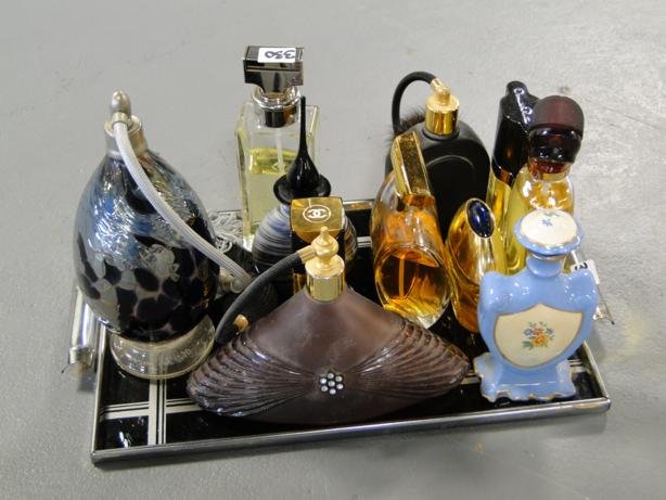 Eleven high quality perfume bottles to include Chan: Eleven high quality perfume bottles to include Chanel No. 5, and others, on an art deco tray