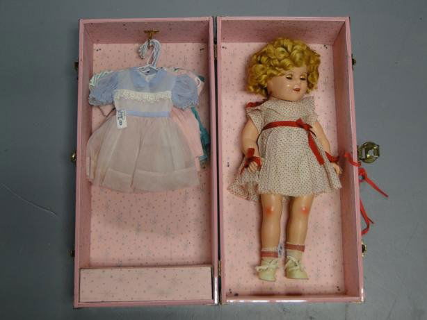 Medium size Shirley Temple composition doll in ori: Medium size Shirley Temple composition doll in original clothes with accessories in doll case