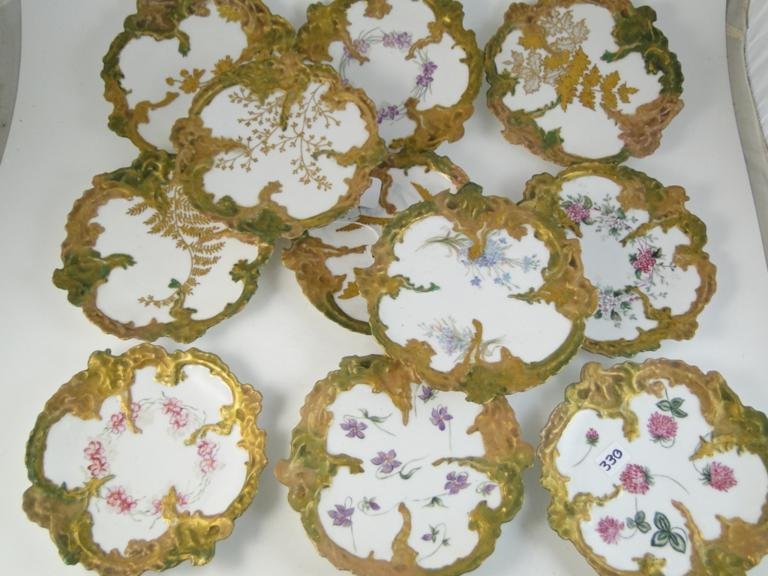 Set of 11 hand painted and heavy gold leaf desert : Set of 11 hand painted and heavy gold leaf desert plates depicting flowers and butterfly's signed Leonard Vienna Austria (possibly Teplitz). Estimate $250-$300
