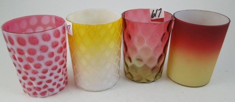 4 Victorian art glass tumblers to include: a quil: 4 Victorian art glass tumblers to include: a quilted yellow to clear satin glass tumbler, a pressed opalescent cranberry tumbler, cased satin glass amberina, and thumb print amberina. Estimate $100-$1