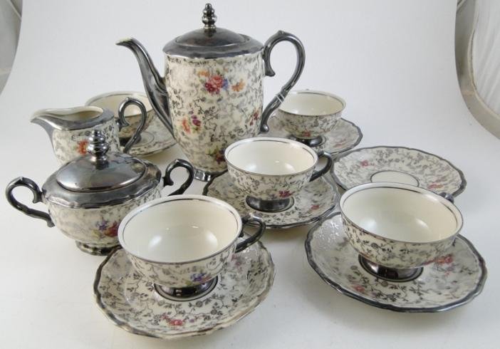 A Bavarian silver overlay tea service with Havilla: A Bavarian silver overlay tea service with Havilland mark, to include: 5 cups and saucers, tea pot, creamer and sugar. Estimate $80-$90