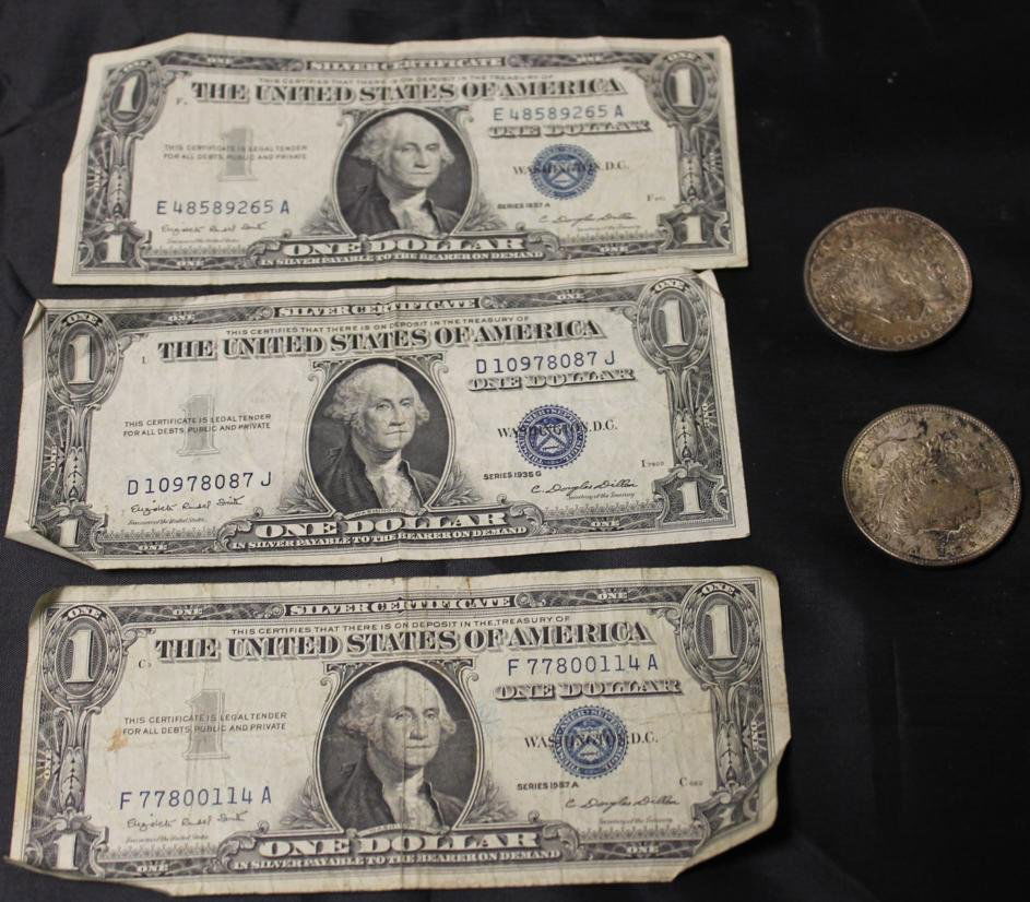 Two Liberty head silver dollars, 1885 and 1921, alon: Two Liberty head silver dollars, 1885 and 1921, along with three silver certificate dollar bills.
