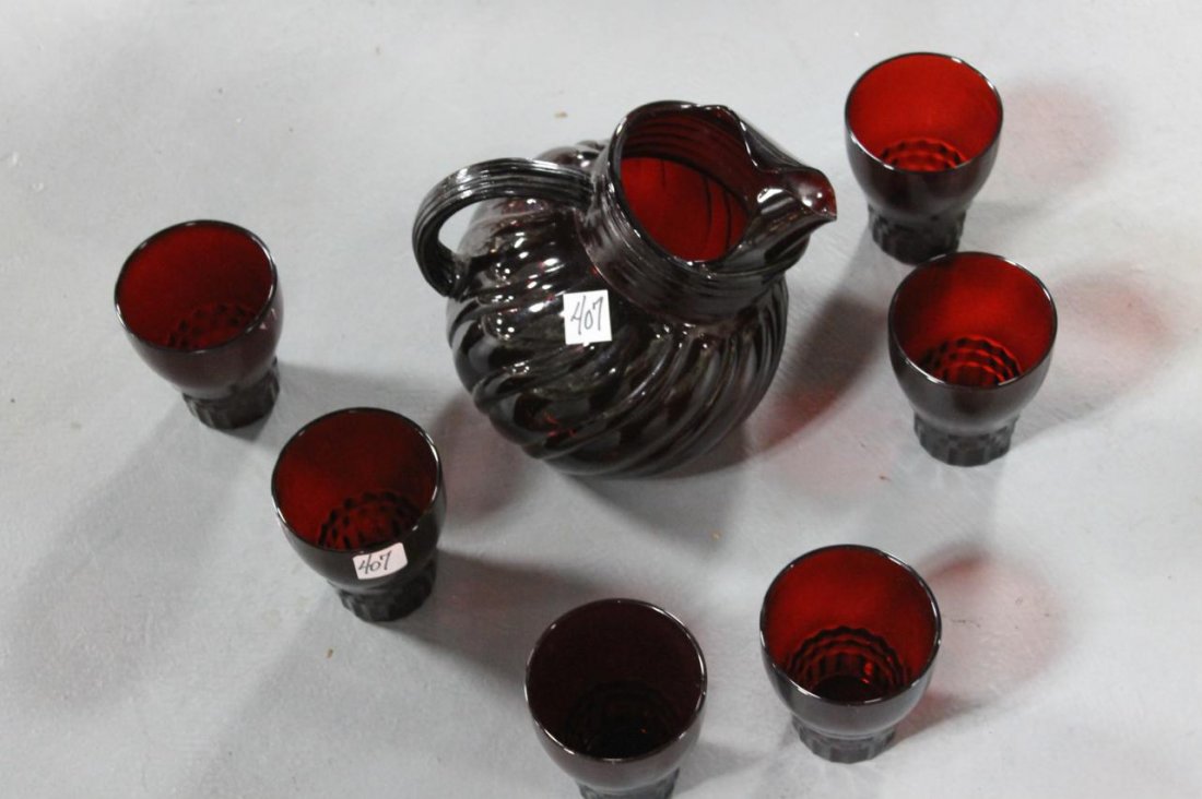 A large ruby glass squirrel pitcher and 6 tumblers: A large ruby glass squirrel pitcher and 6 tumblers