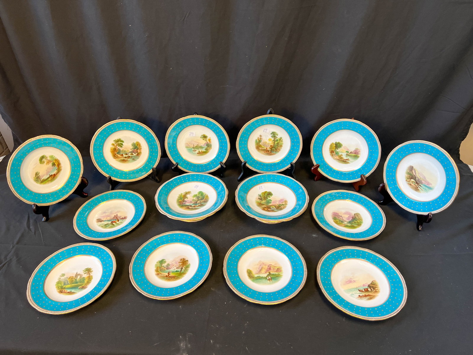 Old Paris 1850s dessert set: An Old Paris 1850s dessert set; each plate has an individual hand painted scene in a French blue border with gold accents to it. Each plate has its own individual hand painted scene. The set consists 