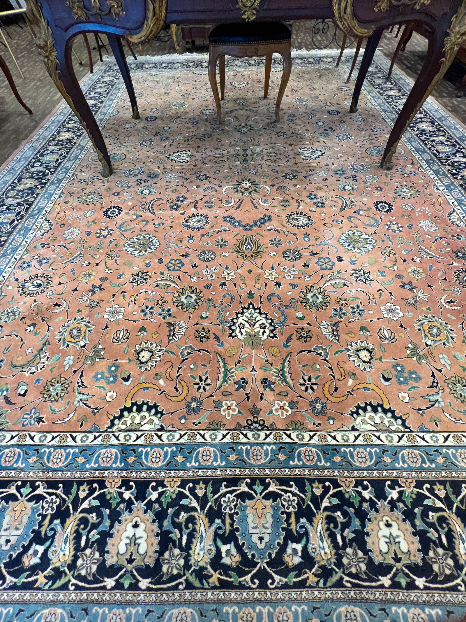 Hand Tied Pakistani Tiara Rug: A Hand tied Pakistani rug Tiara Collection floral pattern in salmon, blues, and cream. It measures 122" wide by 169" length.
