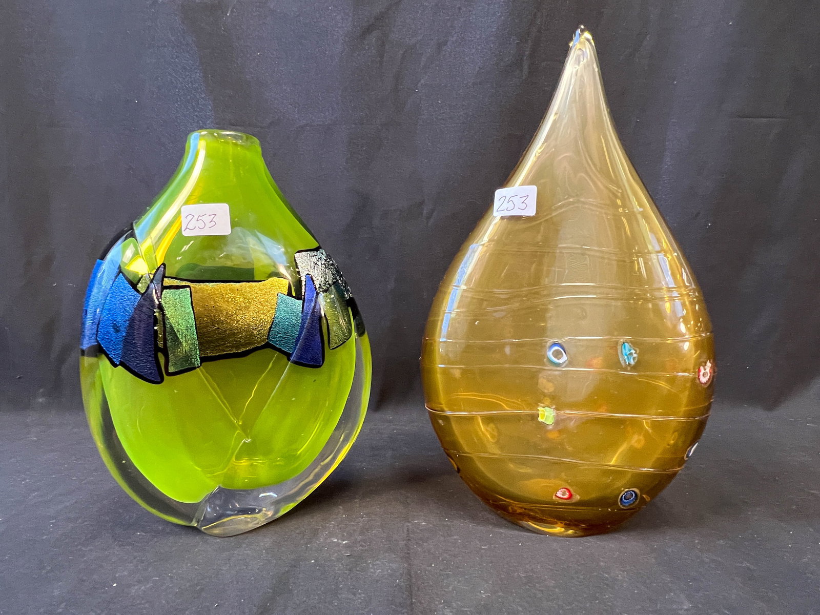 Pair of Hand blown art glass vases one in uranium green with multi-colored adornments in a layered (1 of 2)