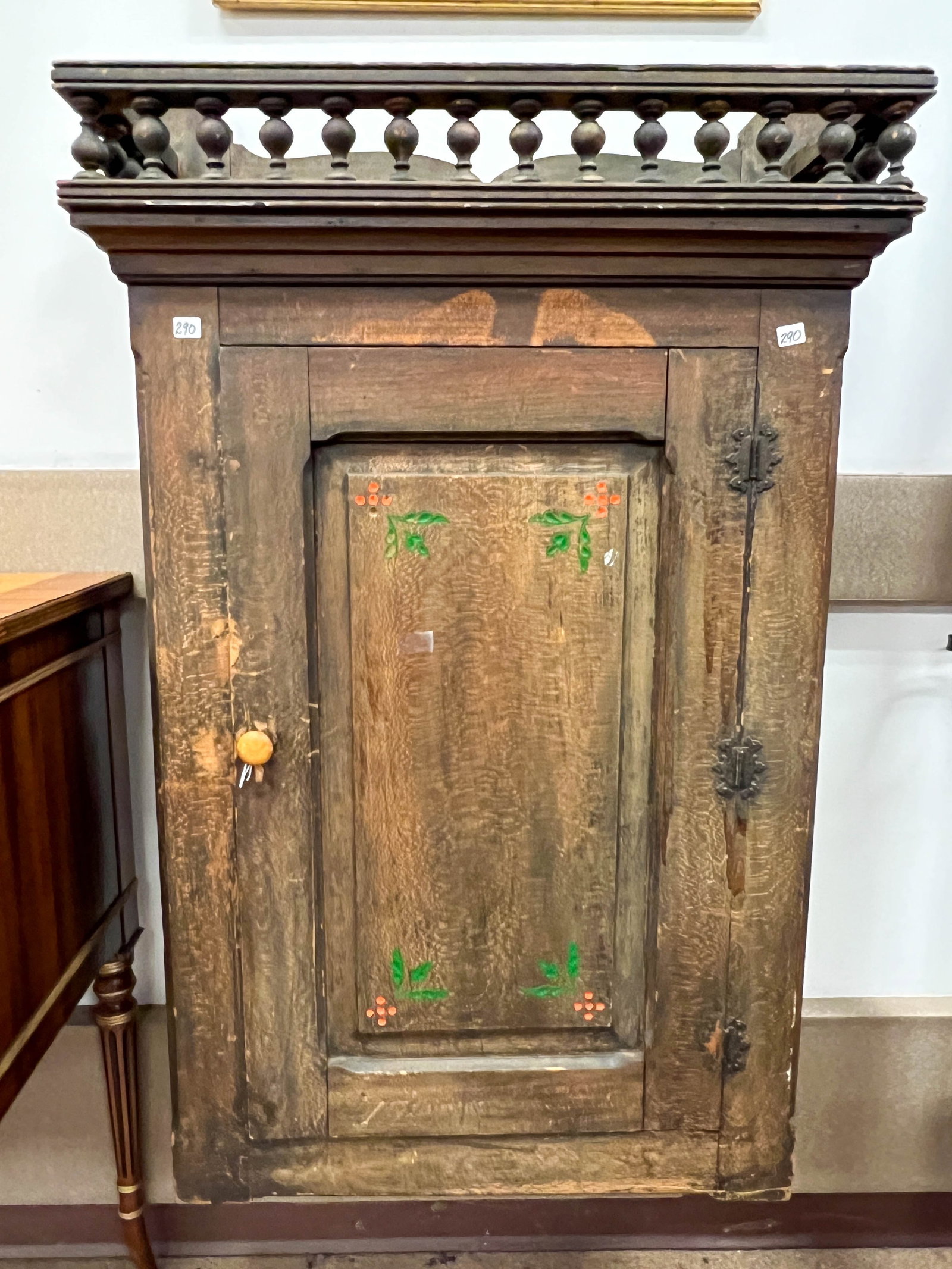 Wall mount barber shop shaving mug cabinet with spindled crown and large chamfered door. Cabinet is (1 of 3)