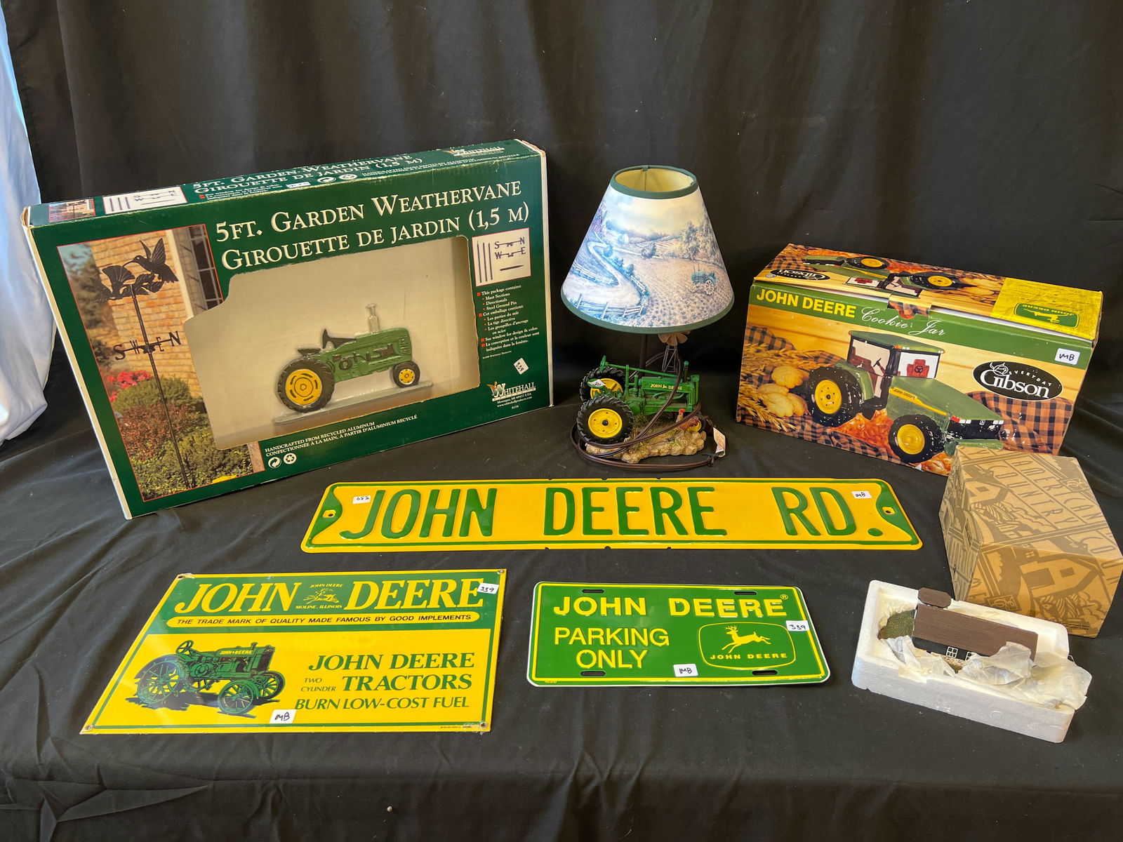 Group of John Deere Collectibles to include: brand new weather vane in box, a tractor lamp, cookie (1 of 1)