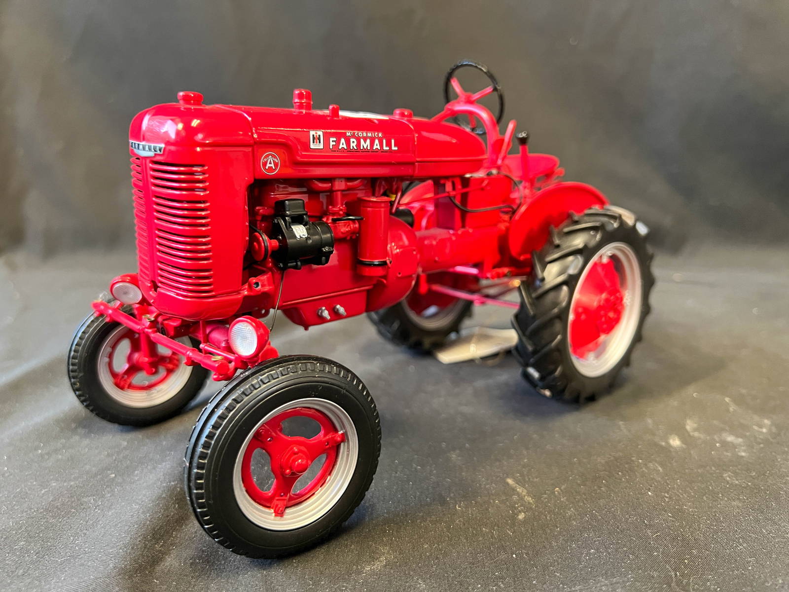Ertl John Deere Toy Tractor And A Farmall Mccormick 1940's Toy Tractor