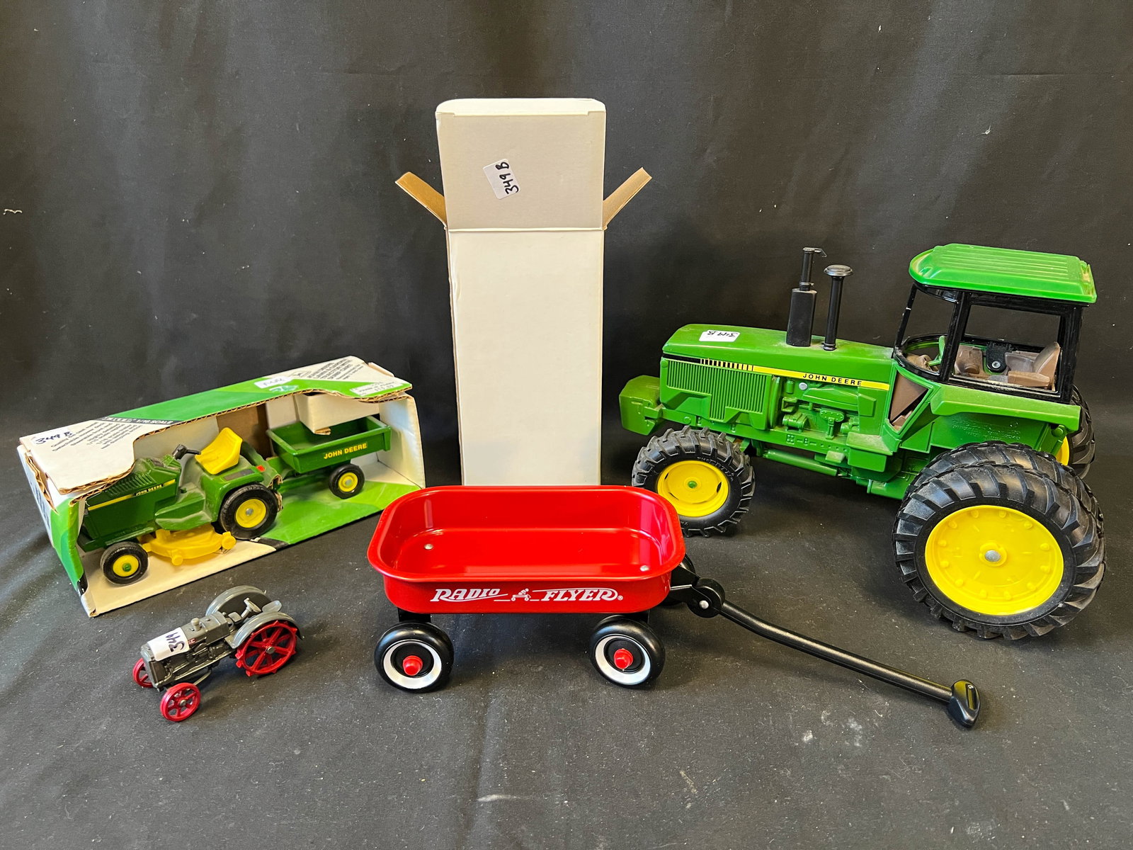 Large lot to include John Deere large 6 wheel tractor with cab; along with miniature turn of the (1 of 1)