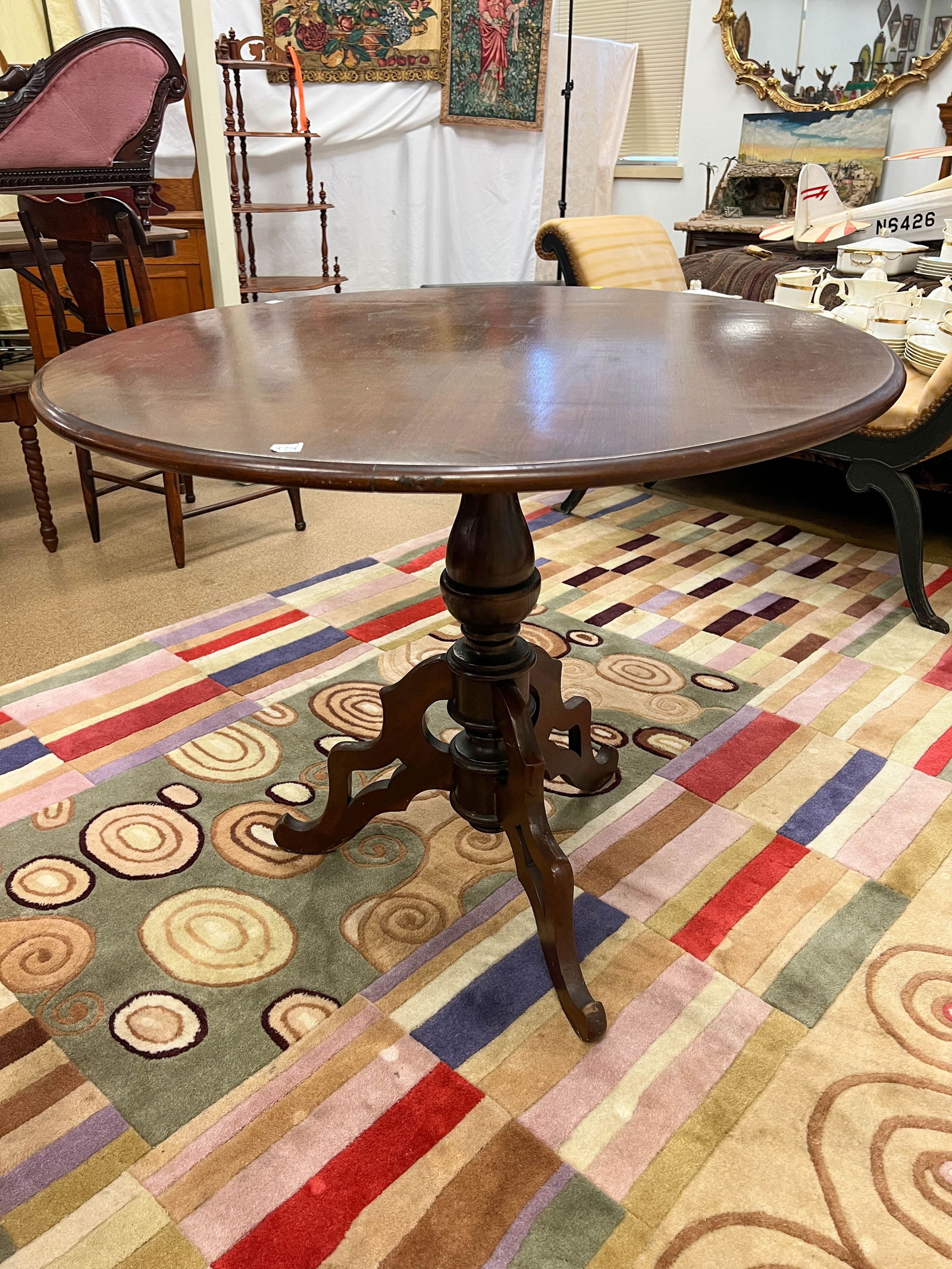 Walnut splayed leg tilt top table with turned pedestal (1 of 3)