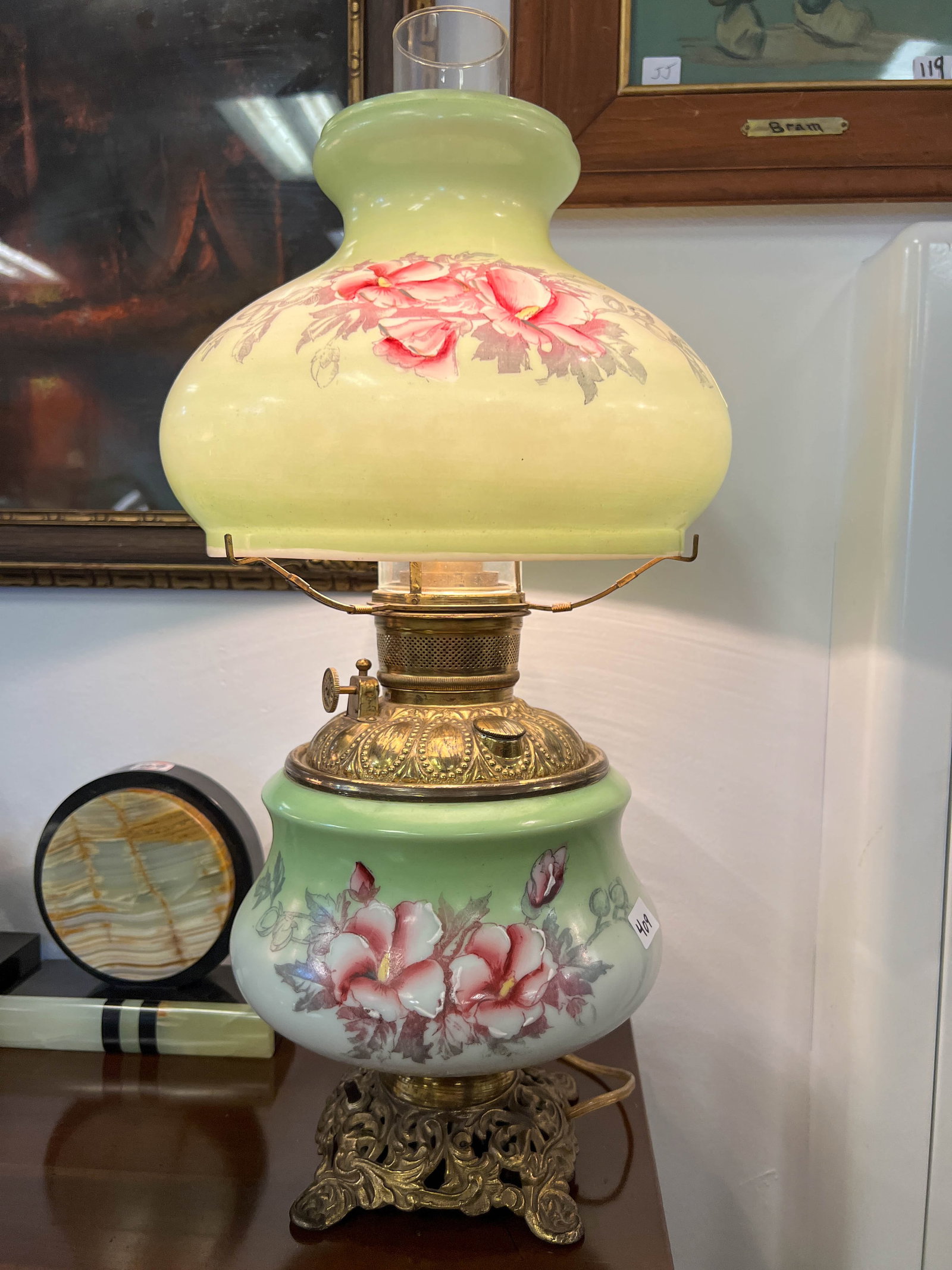 Green oil lamp that has been converted to electric. It measures 21 1/2 in tall: Green oil lamp that has been converted to electric. It measures 21 1/2 in tall