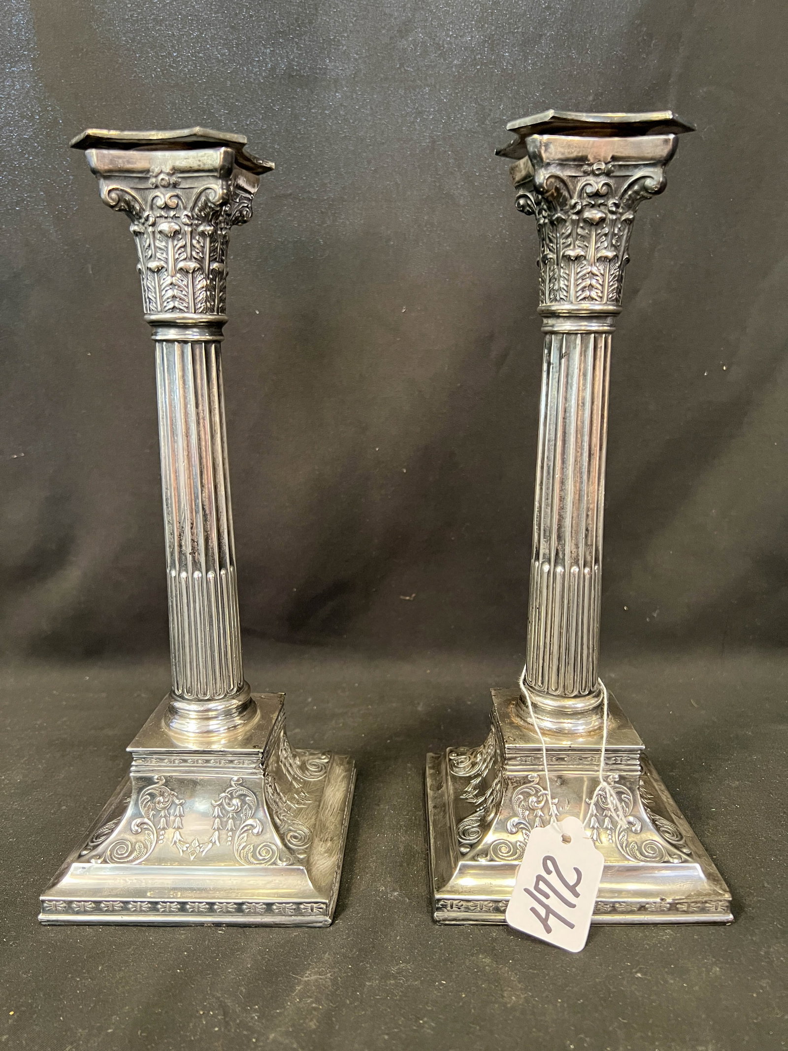Pair of early Wilcox silver plate pillared candle sticks with wax catcher and garland base (1 of 5)