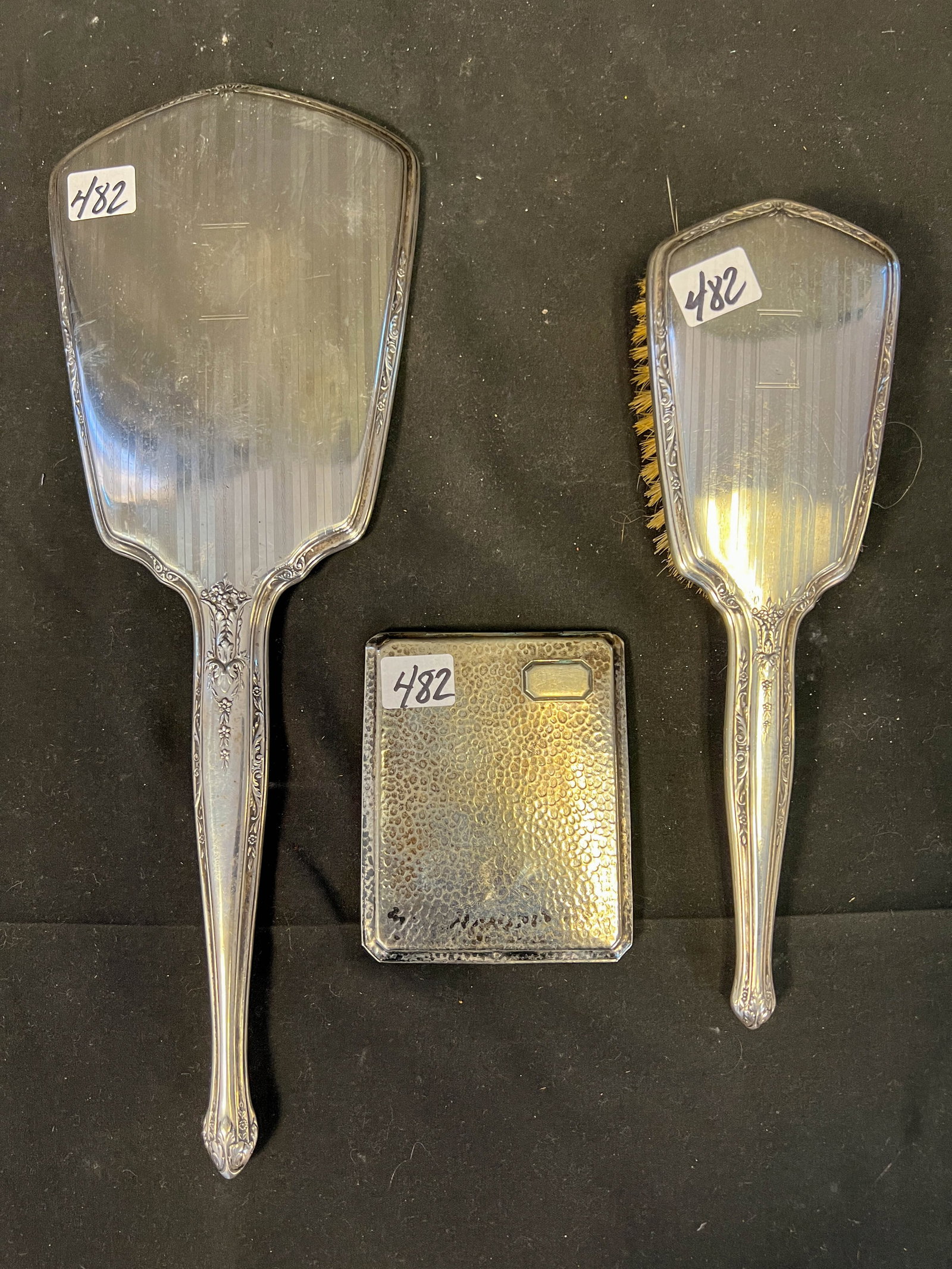 Group of Sterling to include; cigarette case, hairbrush and mirror: Group of Sterling to include; cigarette case (Measures 4" x 3.25"), hairbrush (Measures 9.5"), and a hand mirror (Measures 13.25")