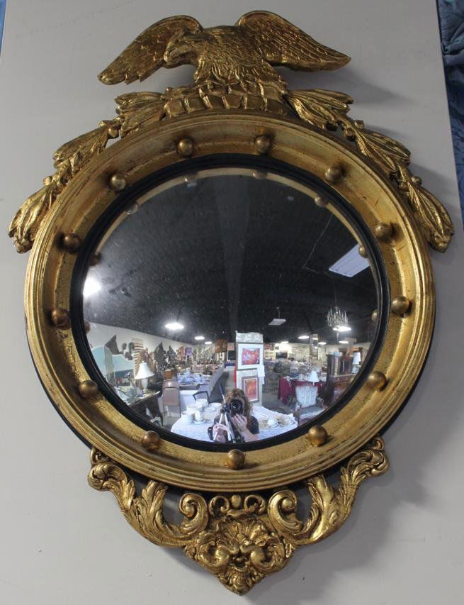Gilt wood, convex mirror with eagle. Mirror is fra: Gilt wood, convex mirror with eagle. Mirror is framed with 13 balls to represent each of the 13 original colonies. Unmarked. Measures approx. 34.5" high x 26" wide.