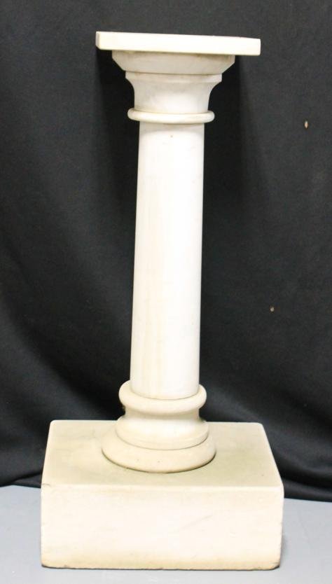 Granite pedestal. Measures 30-3/4" tall. Base is 1: Granite pedestal. Measures 30-3/4" tall. Base is 14" x 10" by 5" tall. Top is 8-5/8" square.