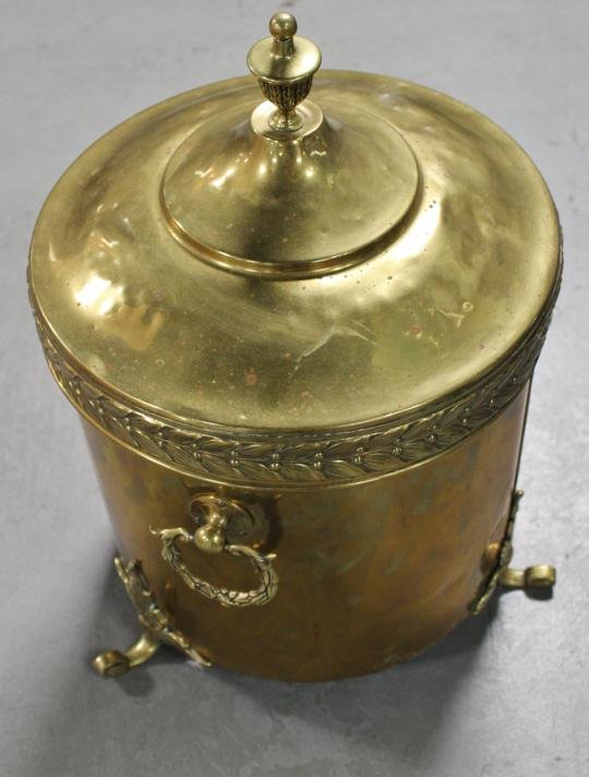Ash can w/ tin liner. 19” high to finial. 3 handle: Ash can w/ tin liner. 19” high to finial. 3 handles & 3 feet. Laurel handles & trim.