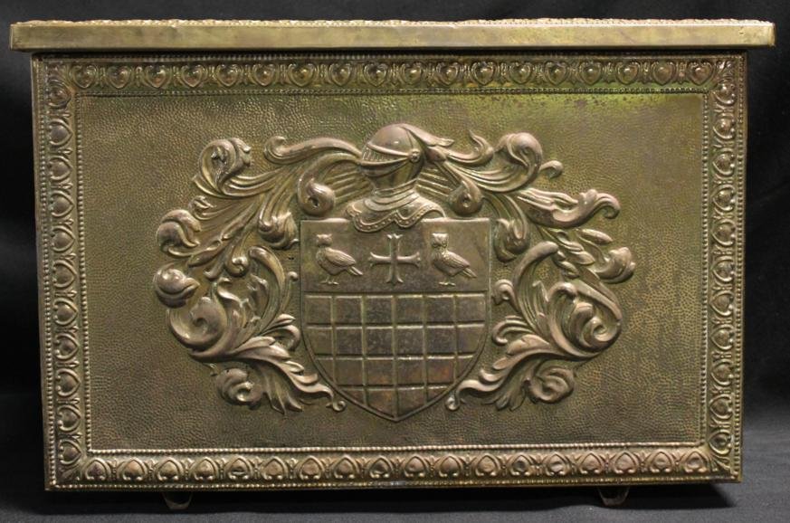 Embossed brass, metal & leather rectangular box. L: Embossed brass, metal & leather rectangular box. Lid features embossed 2 lions w/ heraldic crest. 2 sides are leather lined. Front has embossed design. Back has light brown metal. Approx. 11.5" high x