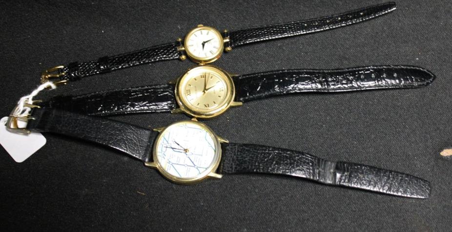 Lot of 2 men's watches & 1 women's watch w/ black: Lot of 2 men's watches & 1 women's watch w/ black leather bands. 1.) Men's Perry Ellis quartz. 2.) Men's "The London Underground" by Peers Hardy". 3.) women's Gucci watch.