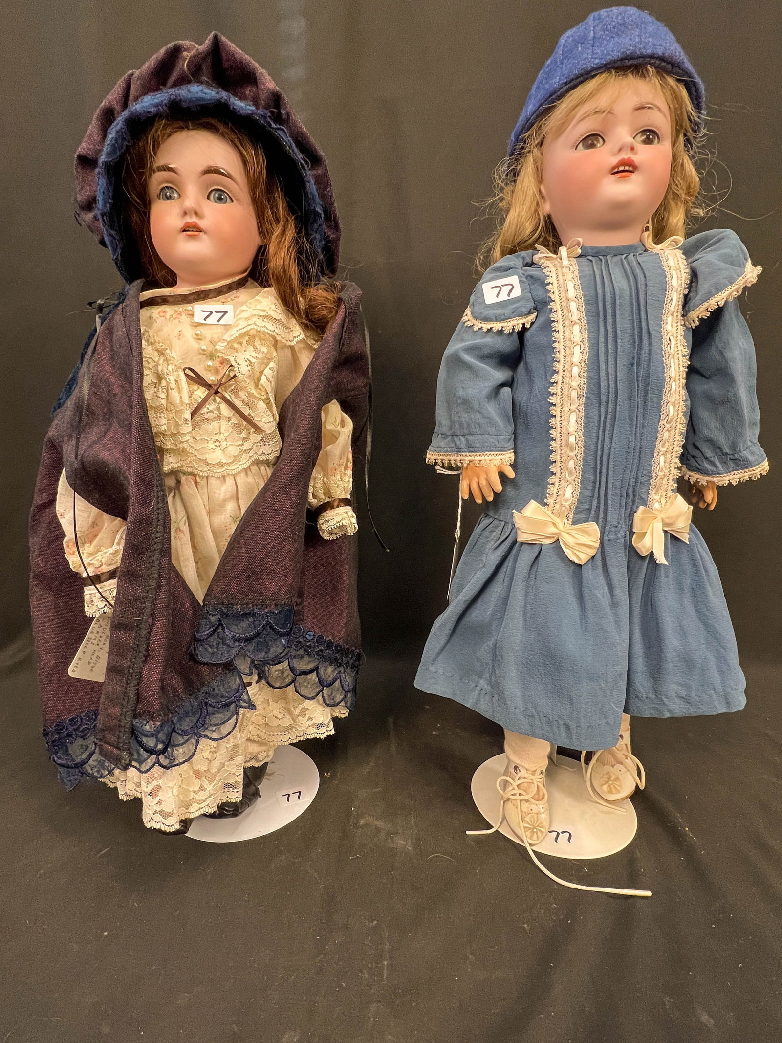 Two Antique Bisque Head Dolls: 2 Kestners JDK bisque head dolls. One has a leather body marked 154 and the other has a composition body marked 168 with ball joints and early square molded teeth. Both dolls have sleep eyes and origi