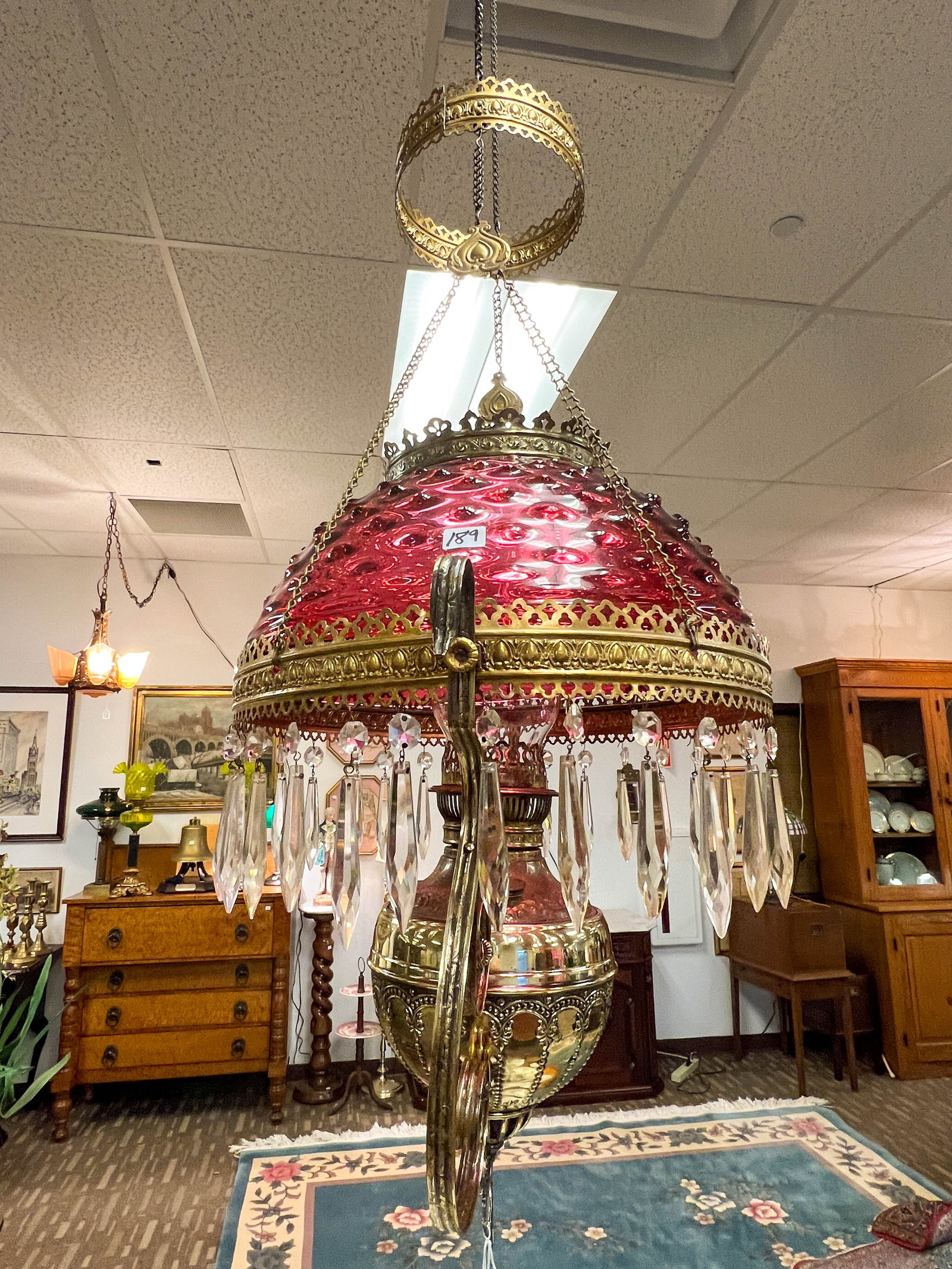 All Original Hanging Cranberry Oil Chandelier: Hanging Cranberry oil chandelier with a hobnail cranberry glass shade. This is all original and has not been electrified. It has been professionally polished.