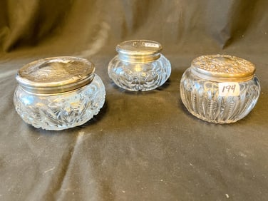 Three Sterling Trimmed Crystal Dresser Jars