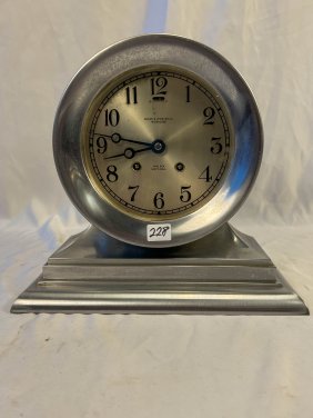 Chelsea Silver over Bronze Clock along with a Hardcover Book on Chelsea Clocks