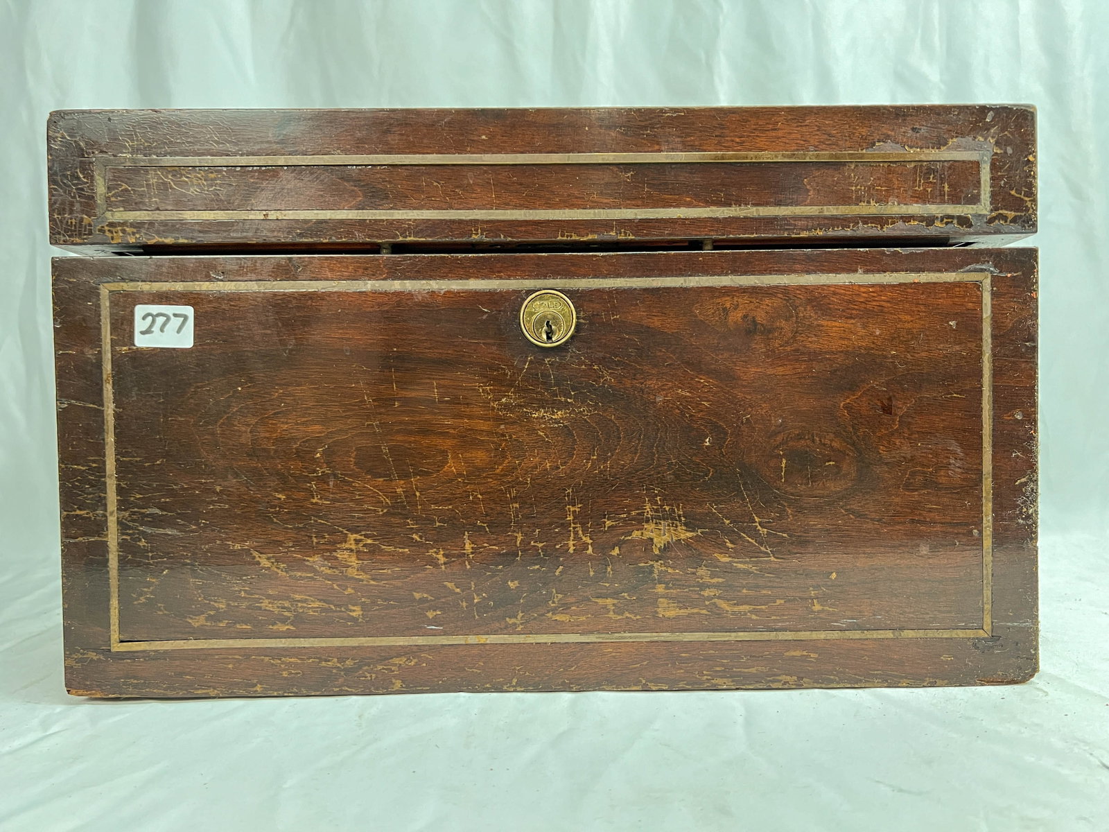 Turn of the Century Mahogany and Brass Humidor: Turn of the century mahogany and brass inlay with brass handles, metal interior 9" x 15"x 12". Original finish, but in used condition.