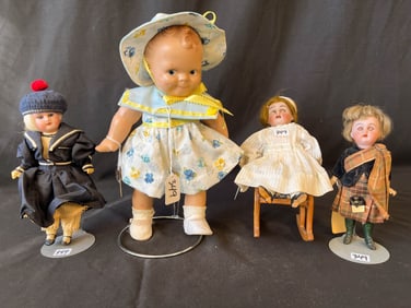 Three Miniature Bisque Head Dolls in Fancy Dress and a Composition Scootles