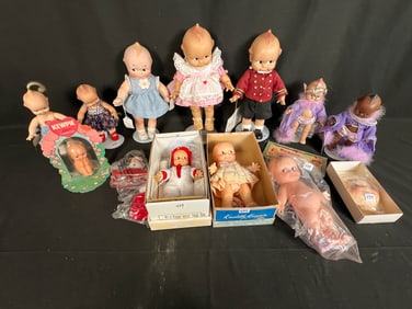 12 Kewpie Dolls Some in their Original Boxes and Packaging