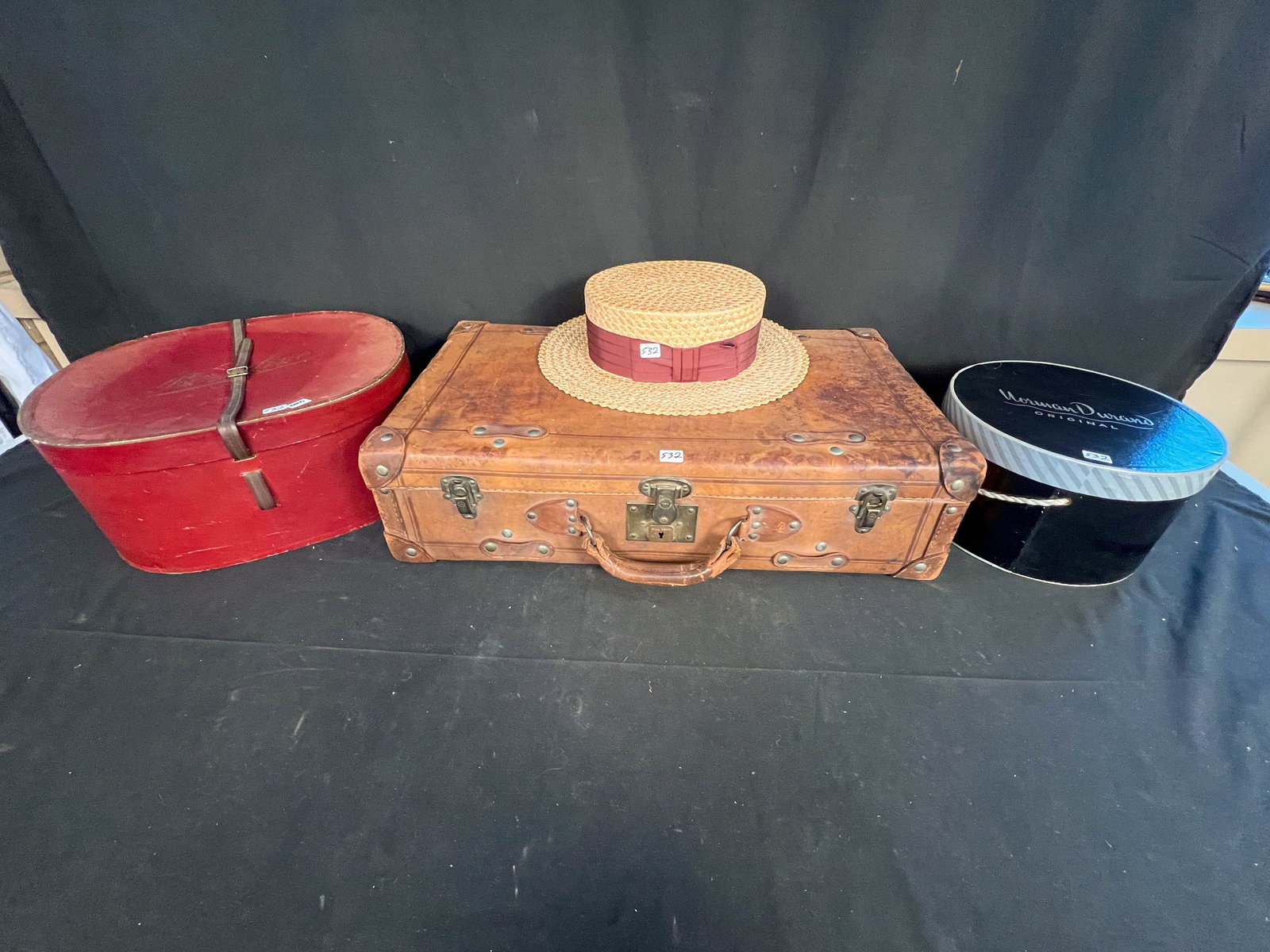 Lot to include a Leather Suitcase (24" x 13" x 6"), 2 Hat Boxes and a Hat (1 of 4)