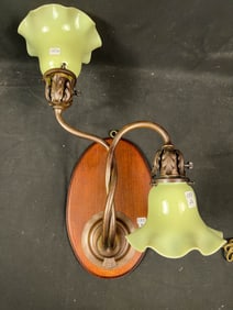 Turn of the Century nouveau Style Two Armed Twisted Wall Fixture with Vaseline Glass Shades.
