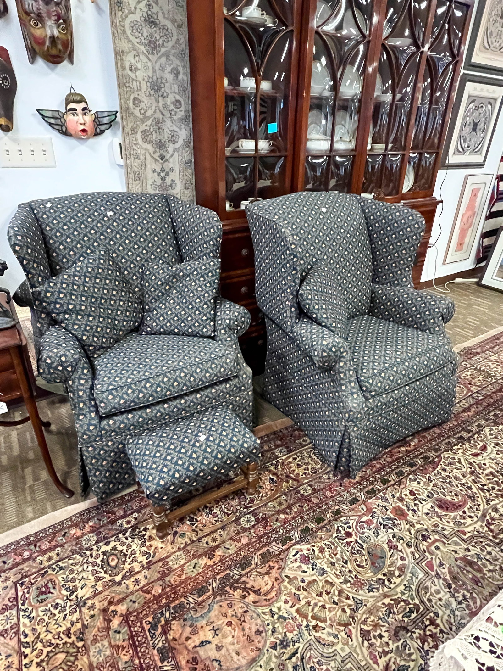Pair of Contemporary Upholstered Wing Chairs and Footstool: Broyhill chairs measure 34" wide x 34" deep and 44" tall. Footstool measures 12" tall x 17" long x 11" deep. They are all in excellent condition with no wear or stains to the upholstery.