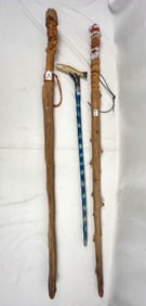 3 Walking sticks, one head, fish, and Santa