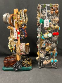 Two Designer Displays Filled with Earrings and Bracelets