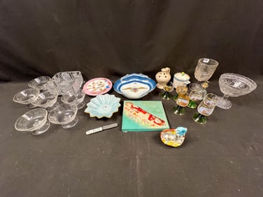 A mixed lot of terracotta, beaded, wood carving, pottery ethnic group in with glassware.