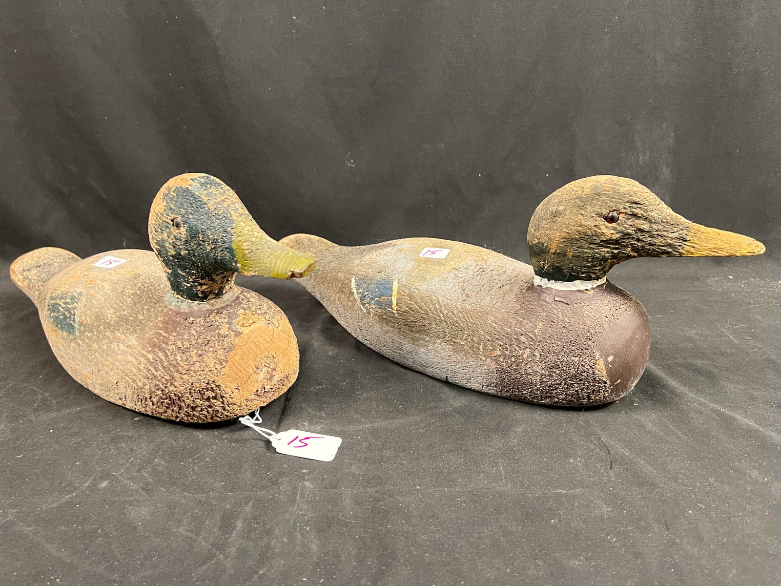 Pair of Duck Decoys: Wood decoys hand painted with glass eyes.