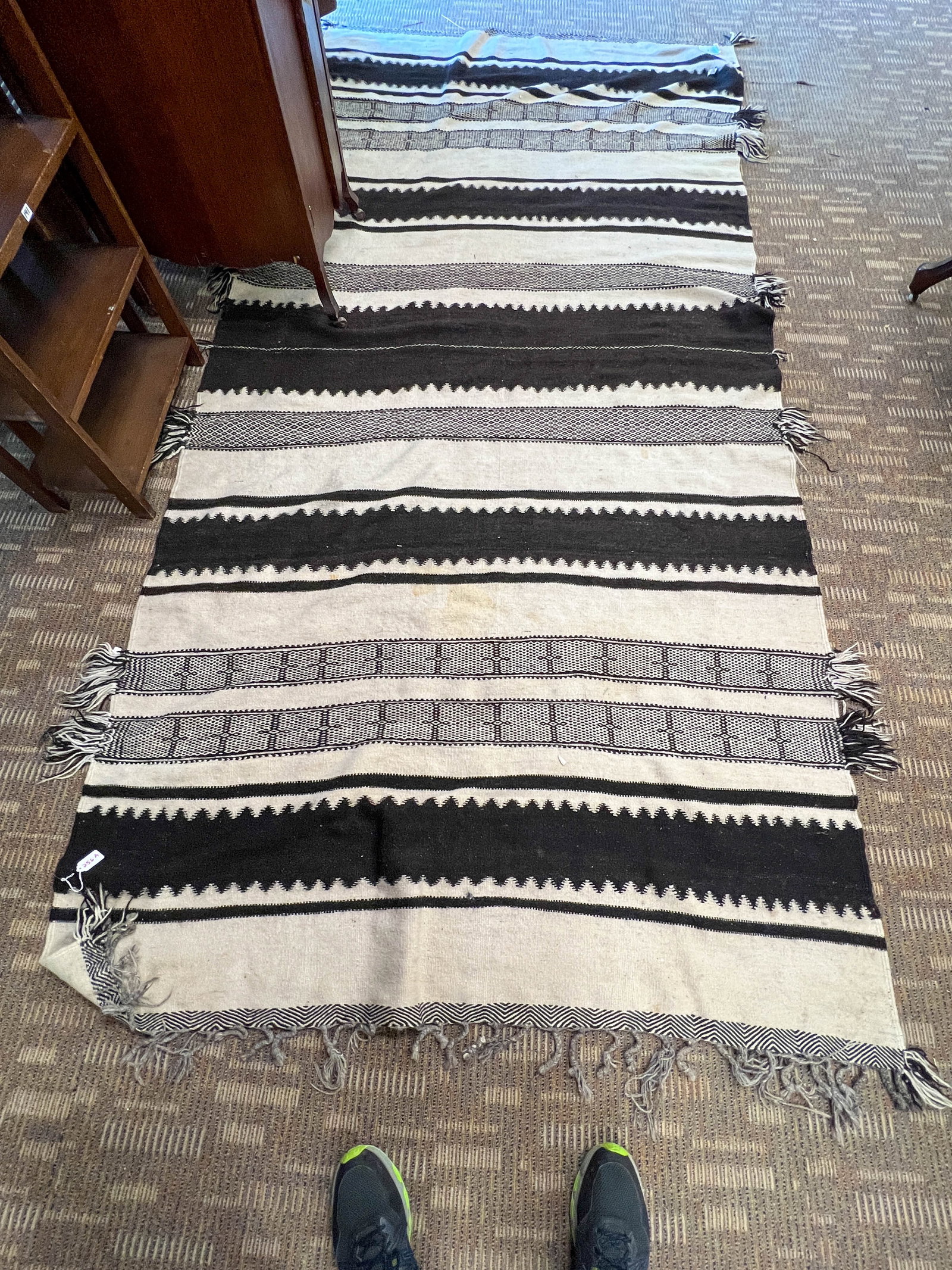 Moroccan Berber Rug: Moroccan Berber Rug in black and cream. Measures 11' x 5'.