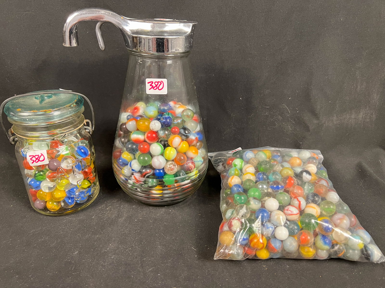 Lot of antique marbles in syrup and canning container: Lot of antique marbles in syrup and canning container