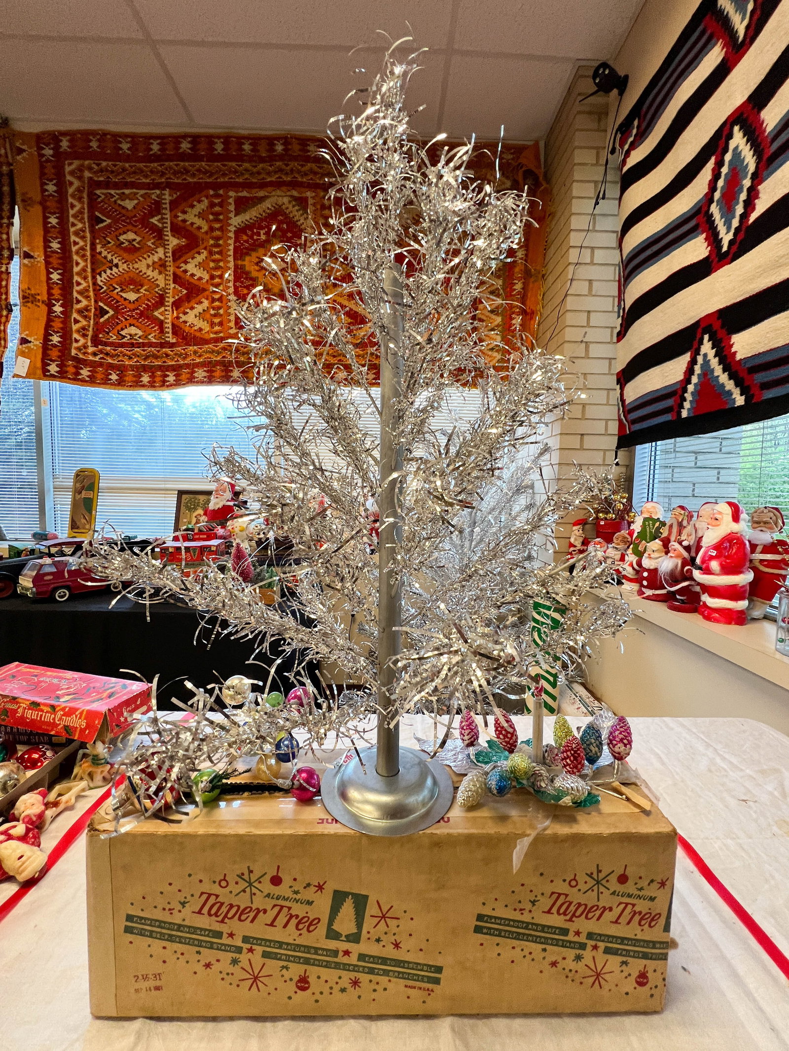 Aluminum Taper Tree with frosted silver ornaments: Aluminum Taper Tree small 28" t x 20" wide. Includes frosted silver ornament decorations.
