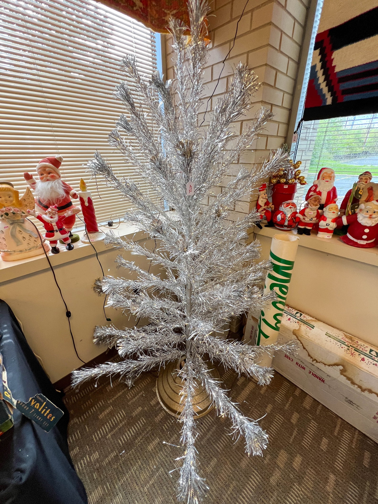 Aluminum Taper Tree with Star Bell Revolving Tree Holder: Aluminum Taper Tree with Star Bell Revolving Tree Holder in original boxes. Measures 6' x 4'.