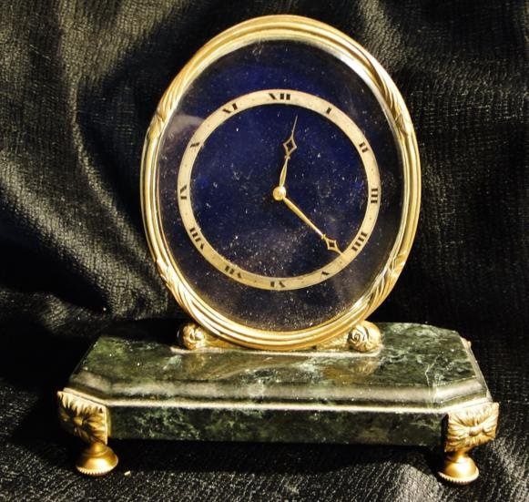 A very important marble, bronze and lapis table clo: A very important marble, bronze and lapis table clock by Haas Neveux & Co. Geneve. Est. value $350 - 500.