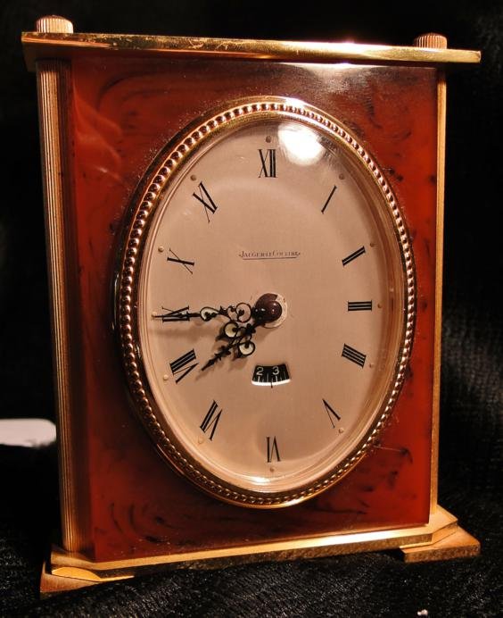 Bronze and faux tortoiseshell desk clock by Jaeger : Bronze and faux tortoiseshell desk clock by Jaeger le Couture Swiss made 4" tall. Est. value $100 - 125.